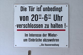 Anti-burglary sign in an apartment building