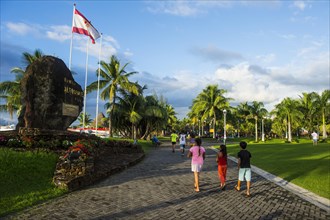 Local people strolling on the waterfront parc of Papeete