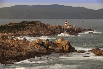 Rocky coast with lighthouse at Ganh Dia