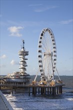 Pier with bungy tower and ferris wheel