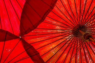 Traditional red opened umbrellas