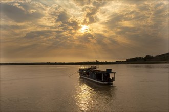 Boat on the Tsiribihina River at sunrise