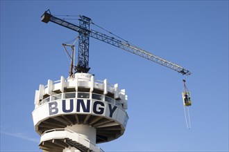 Bungy jump tower with bungy jumper