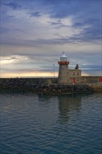 Lighthouse in the harbour of Howth