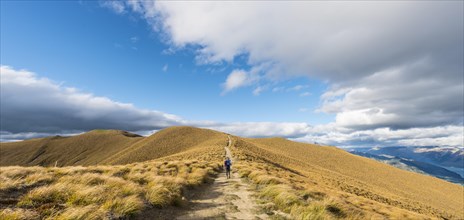 Female hiker on hiking trail to Isthmus Peak