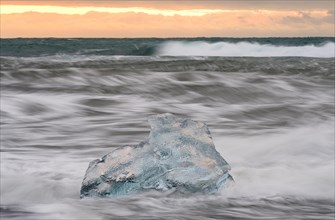 Ice, chunks of ice on lava beach near Jokulsarlon