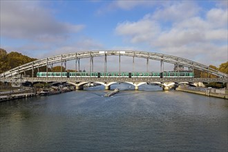 Metro crosses the Seine on steel bridge