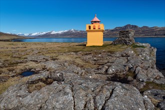 Orange lighthousehouse