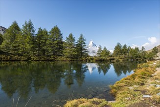 Snow-covered Matterhorn reflected in the lake