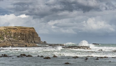 Cliffs and foaming waves