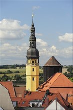 View from Reichenturm onto rooftops of old town with town hall tower and water tower