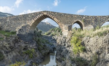 Medieval Saracens bridge crossing the river Simeto