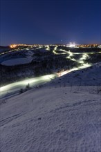 Lit cross-country ski trail at night