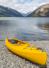 Yellow Kayak lying on the beach
