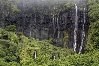 Waterfalls over lava rocks