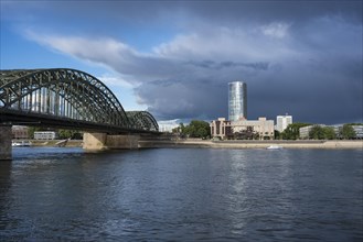 Hohenzollern bridge with the Hotel Hyatt Regency and the high-rise office building Kolntriangle Cologne