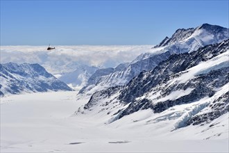 Helicopter above Aletsch glacier with snow