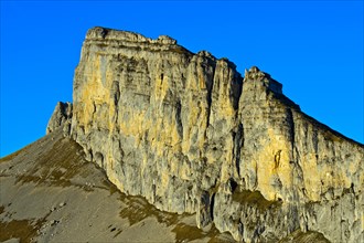 Vertical rock wall at summit Tour d'Ai in the evening light