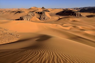 Sanddunes and rock towers at Moul Naga