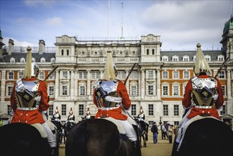 The Royal Guards in red uniform on horses
