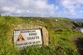 Sign with warning of mining shafts