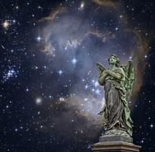 Statue of an angel in front of a starry sky