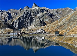 Reflection in the Lac du Grand St. Bernard mountain lake on the Grosse Sankt Bernhard Pass