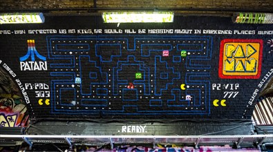 Graffiti of the computer game Pac-Man in a pedestrian tunnel