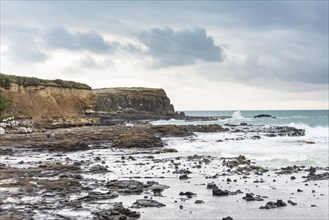 Cliffs and foaming waves