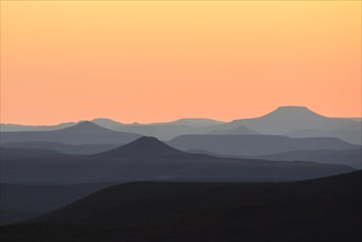 Staggered mountains at sunset