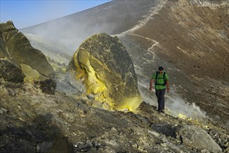 Hiker on the Gran Cratere walks through sulphur fumaroles