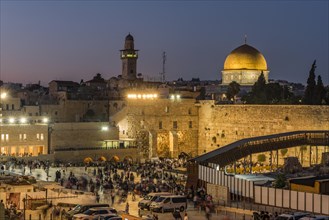Believers at the Wailing Wall at dusk