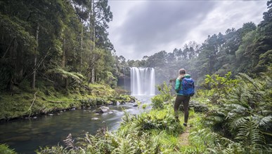 Hiker faces waterfall