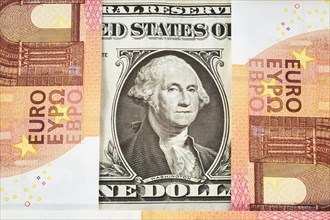 George Washington portrait on US one dollar bill with10 Eurospaper currency bank notes