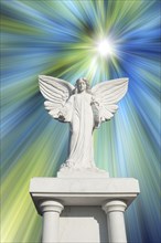 White angel statue with blue and white rays