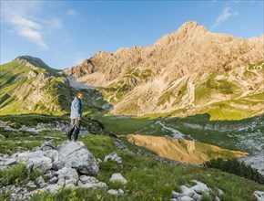 Hiker looking to the mountains