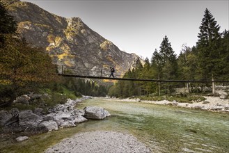 Bridge over Isonzio river in autumn mood in Triglav National Park