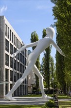 Walking Man sculpture by Jonathan Borofsky in front of insurance company Munich Re
