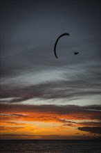 Paraglider at Playa de la Enramada at sunset in Adeje