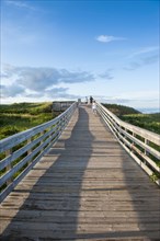 Wooden pier leading to beach of Prince Edward Island National Park