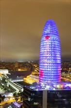 City view with illuminated Agbar Tower at night