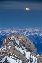 Santis Mountain overlooking Alpstein massif at full moon