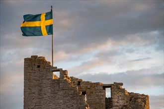 Swedish flag on medieval city wall