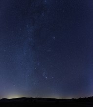 Starry sky with the Milky Way over the Swabian Alb
