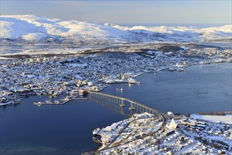 Snowy town with bridge