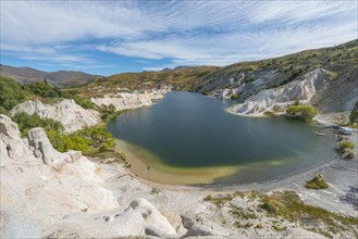 Lake surrounded by limestone cliffs