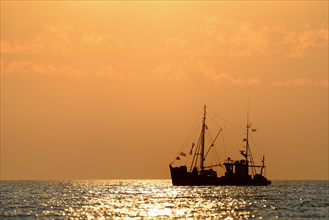 Fishing vessel at sunset