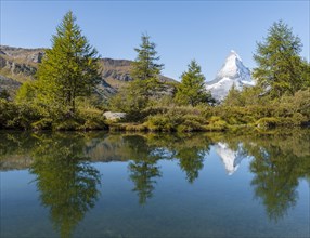 Snow-covered Matterhorn reflected in the lake