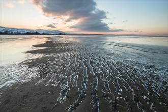 Ice on the shore of Lake Constance on a winter evening