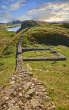 Hadrian's Wall with foundation walls of former watchtower